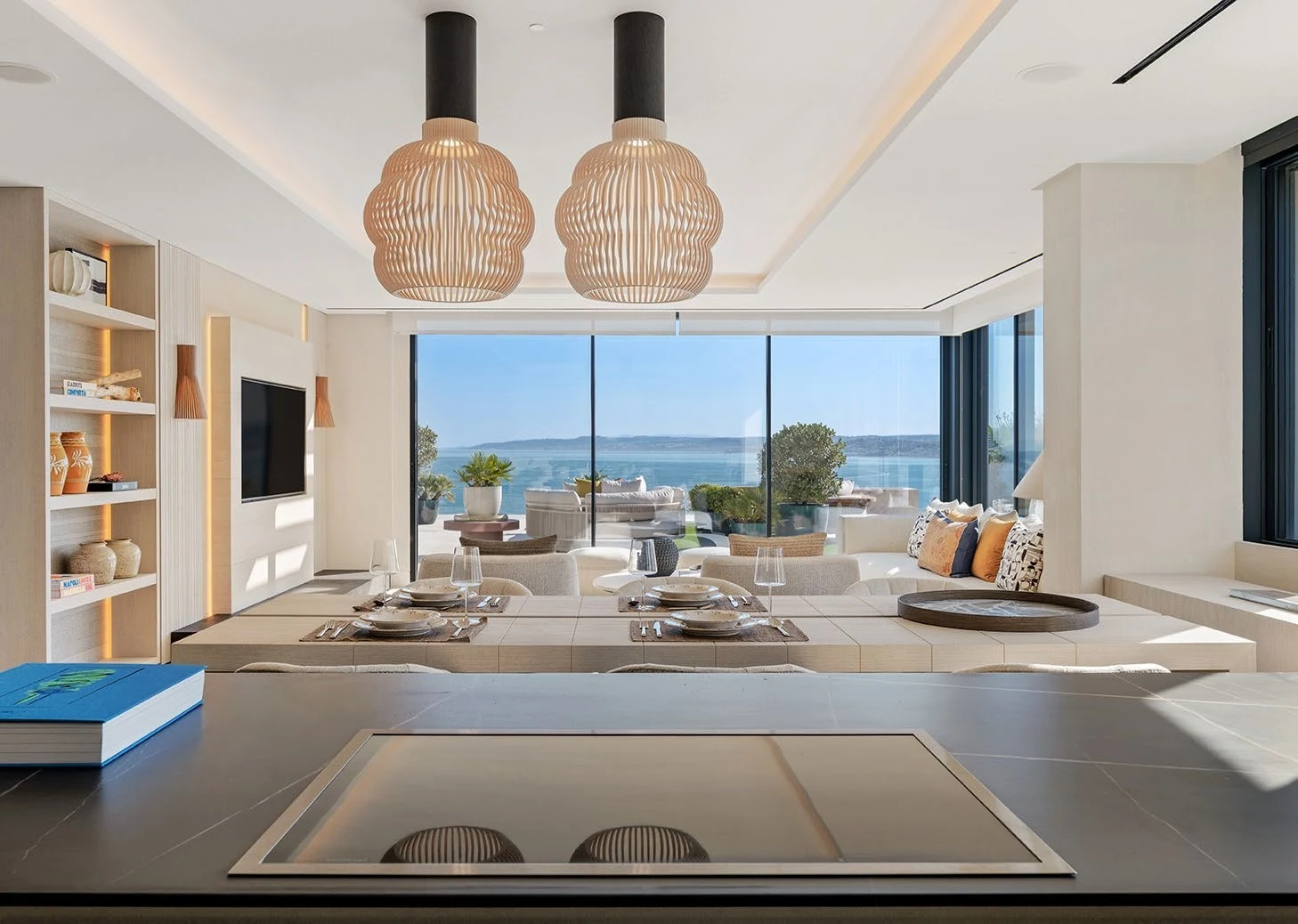 Open-plan dining and living space with sea views