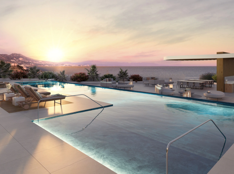 Shared outdoor pool at sunset in a coastal residential community