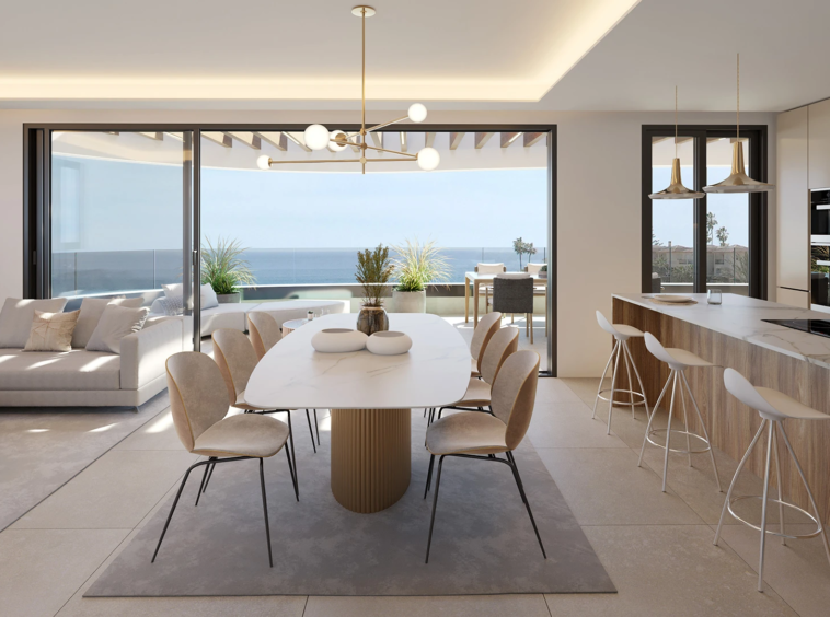 Representative fitted kitchen and dining space with sea views
