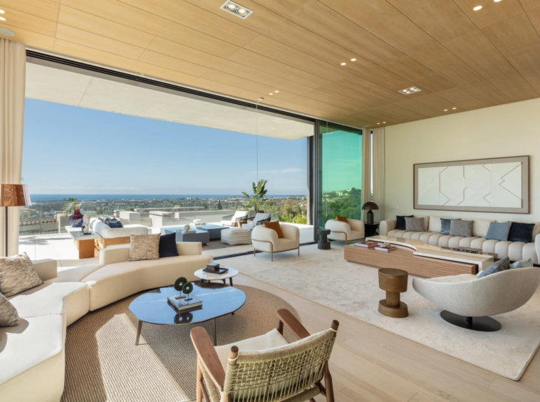 Open living area with sea views and sliding glass walls in La Quinta