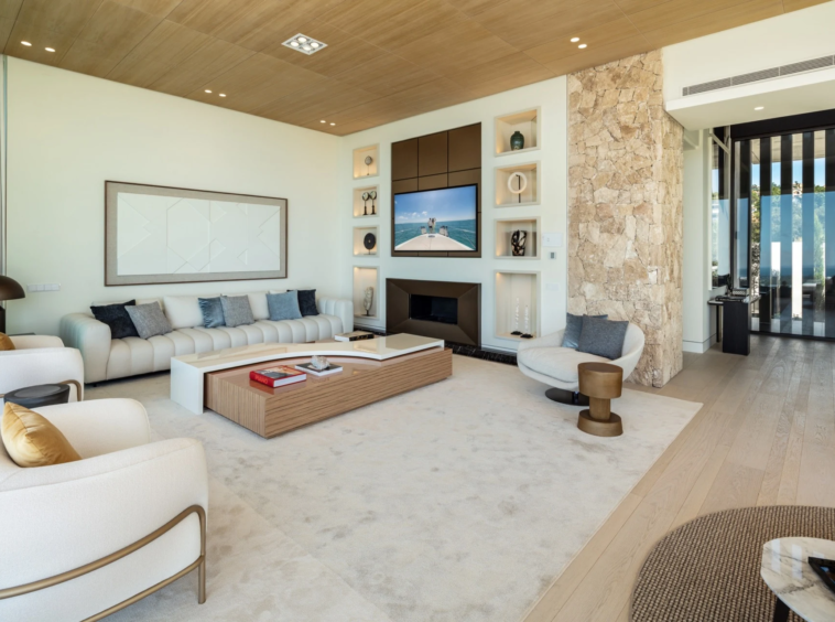 Stone fireplace and timber ceiling in the main living room