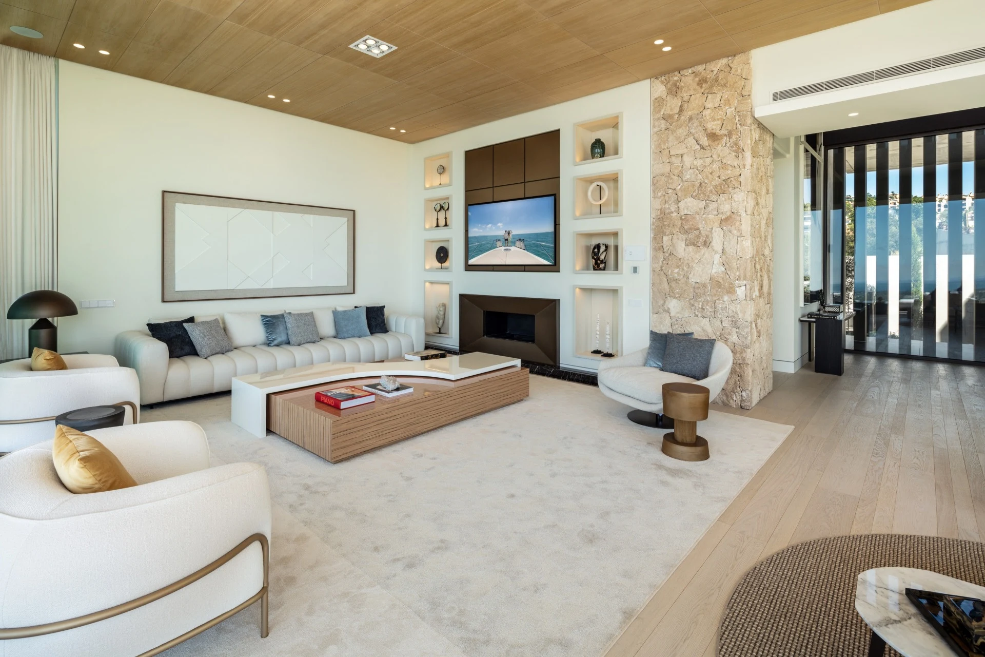 Stone fireplace and timber ceiling in the main living room