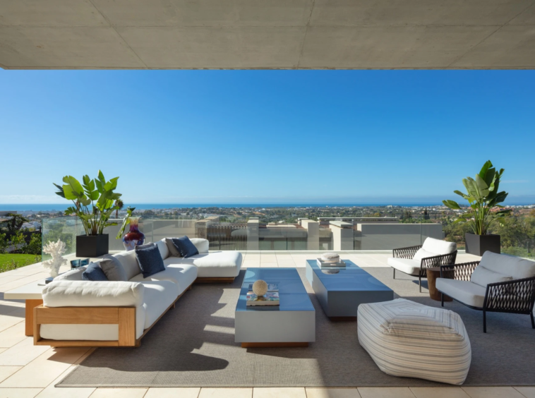Covered lounge terrace overlooking the Mediterranean coastline