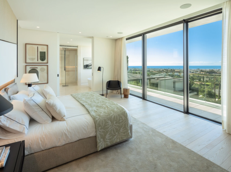 Principal bedroom with a private terrace and sea views
