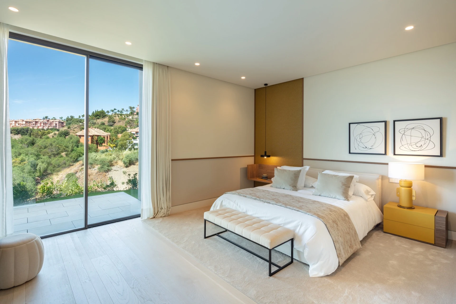 Guest bedroom with corner windows overlooking the hills