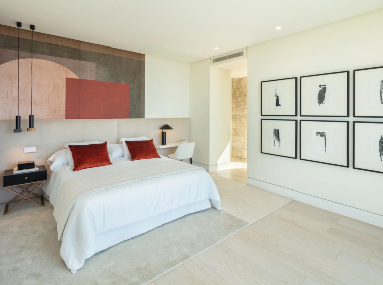 Guest suite with upholstered headboard and fitted bedside tables