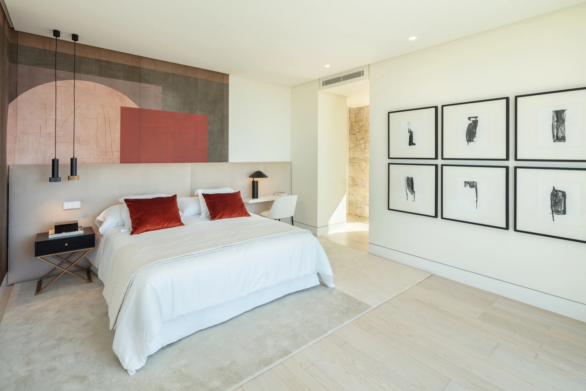 Guest suite with upholstered headboard and fitted bedside tables