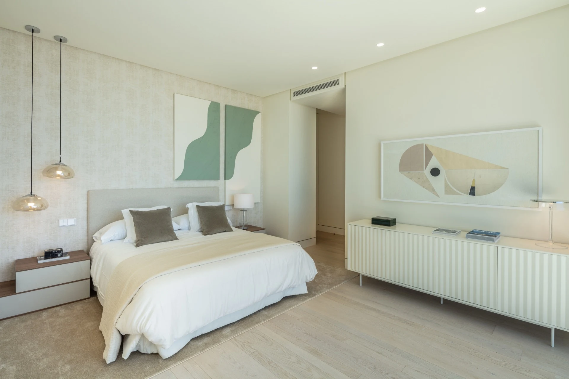 Guest bedroom with pale furnishings and decorative wall panels
