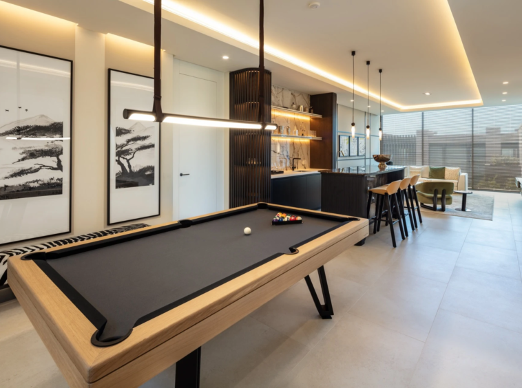 Entertainment room with a billiard table and fitted bar