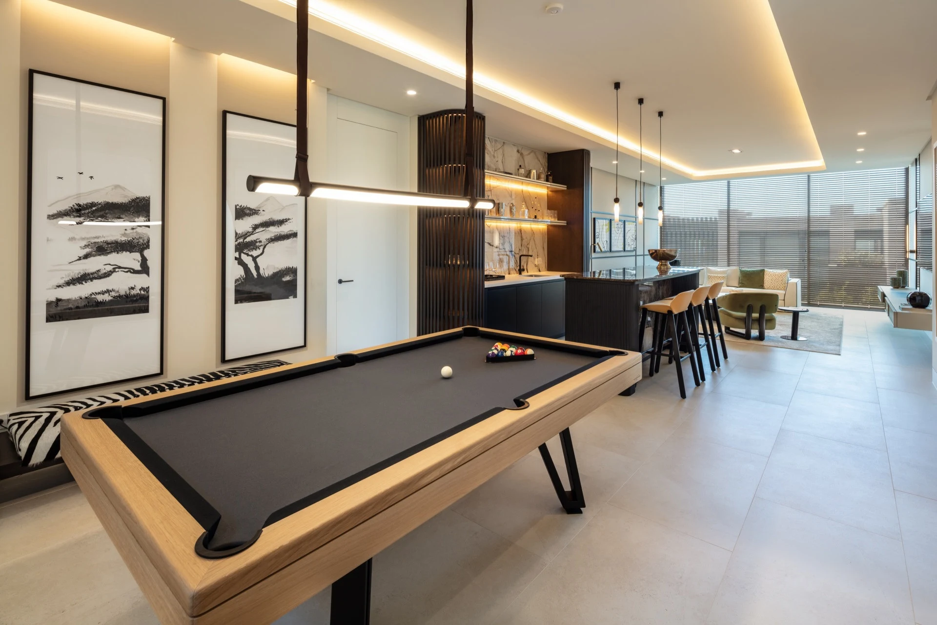 Entertainment room with a billiard table and fitted bar
