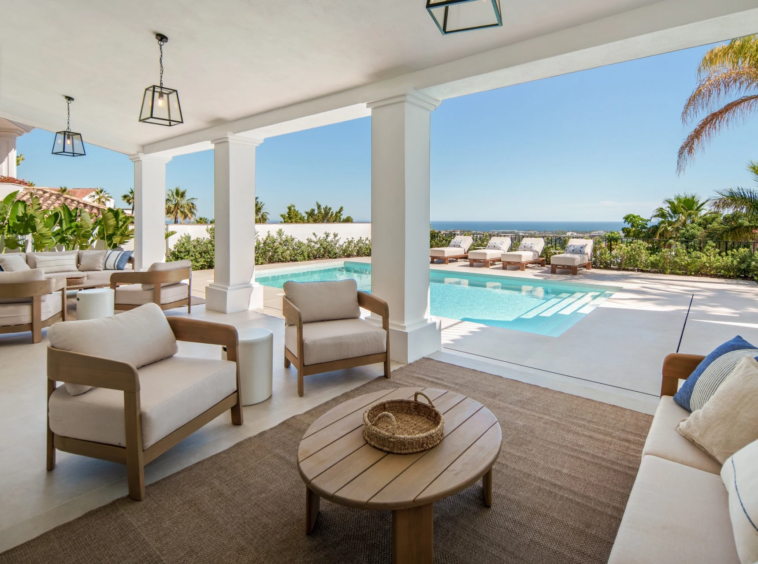 Covered outdoor lounge beside the private swimming pool