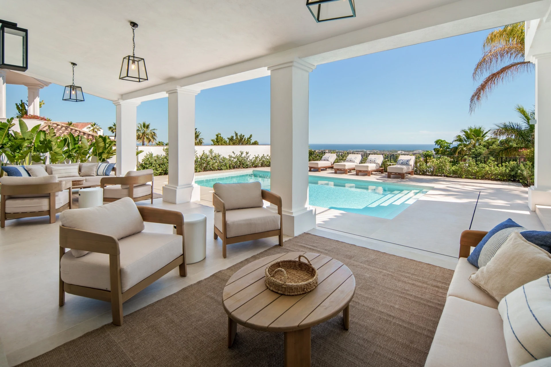 Covered outdoor lounge beside the private swimming pool