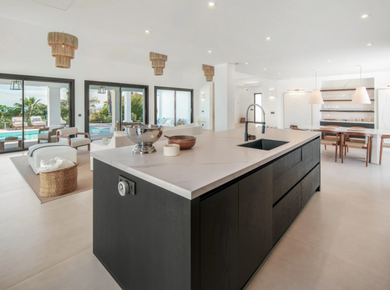 Open-plan kitchen with island and views across the living area
