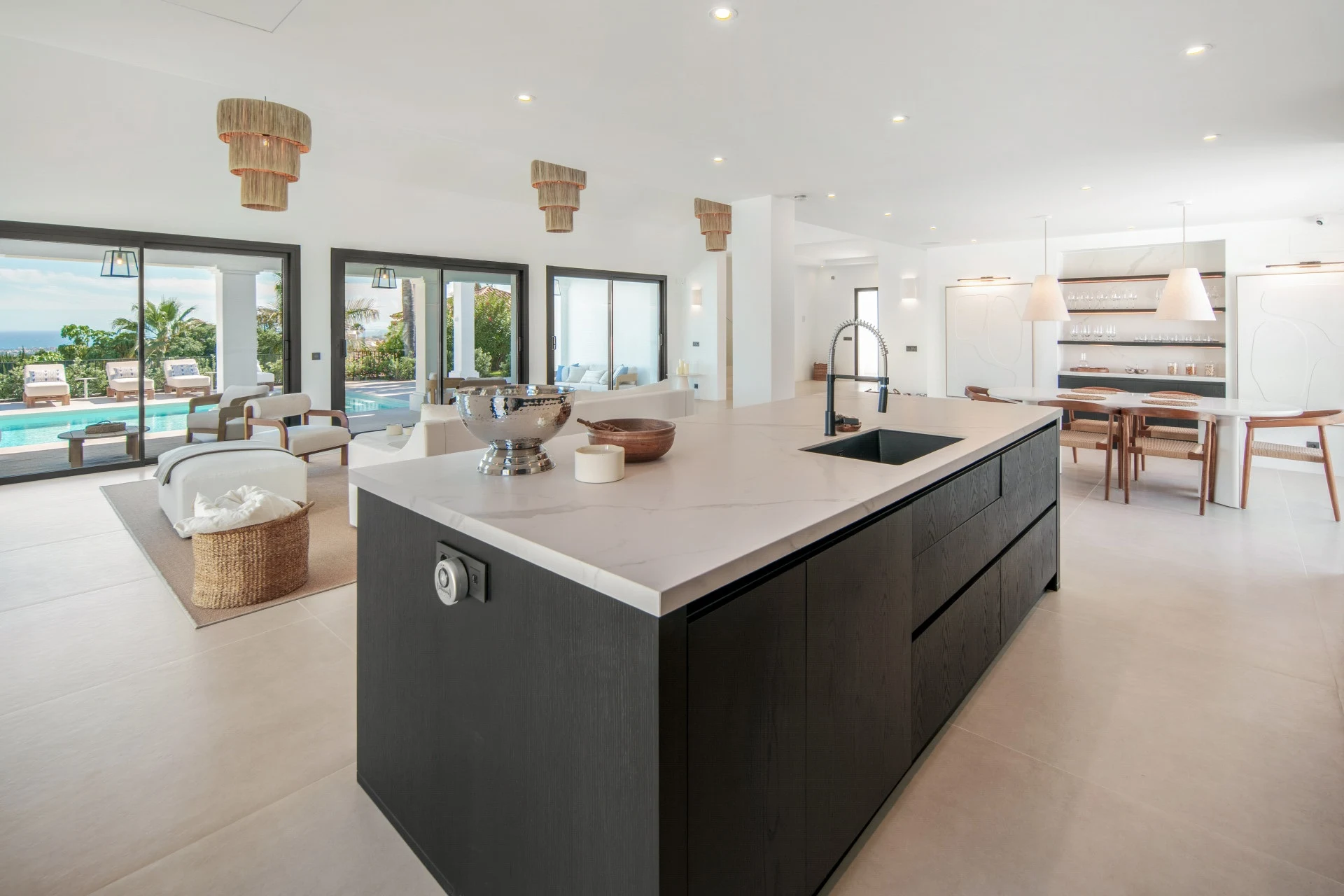 Open-plan kitchen with island and views across the living area