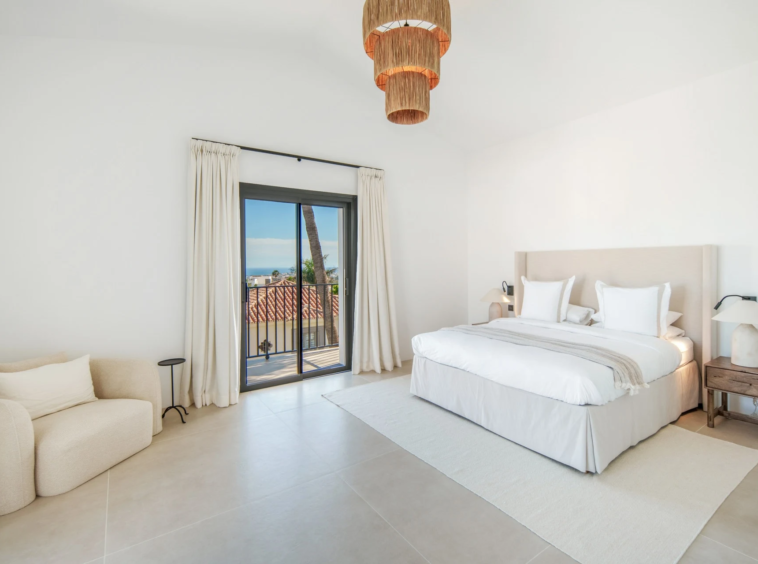 Upper-floor bedroom with balcony access