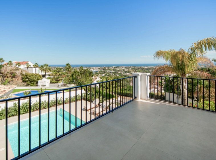 Private balcony overlooking the pool and coastline
