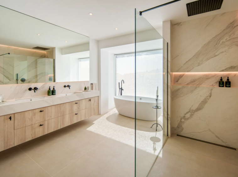 Bathroom with freestanding bath and glazed shower