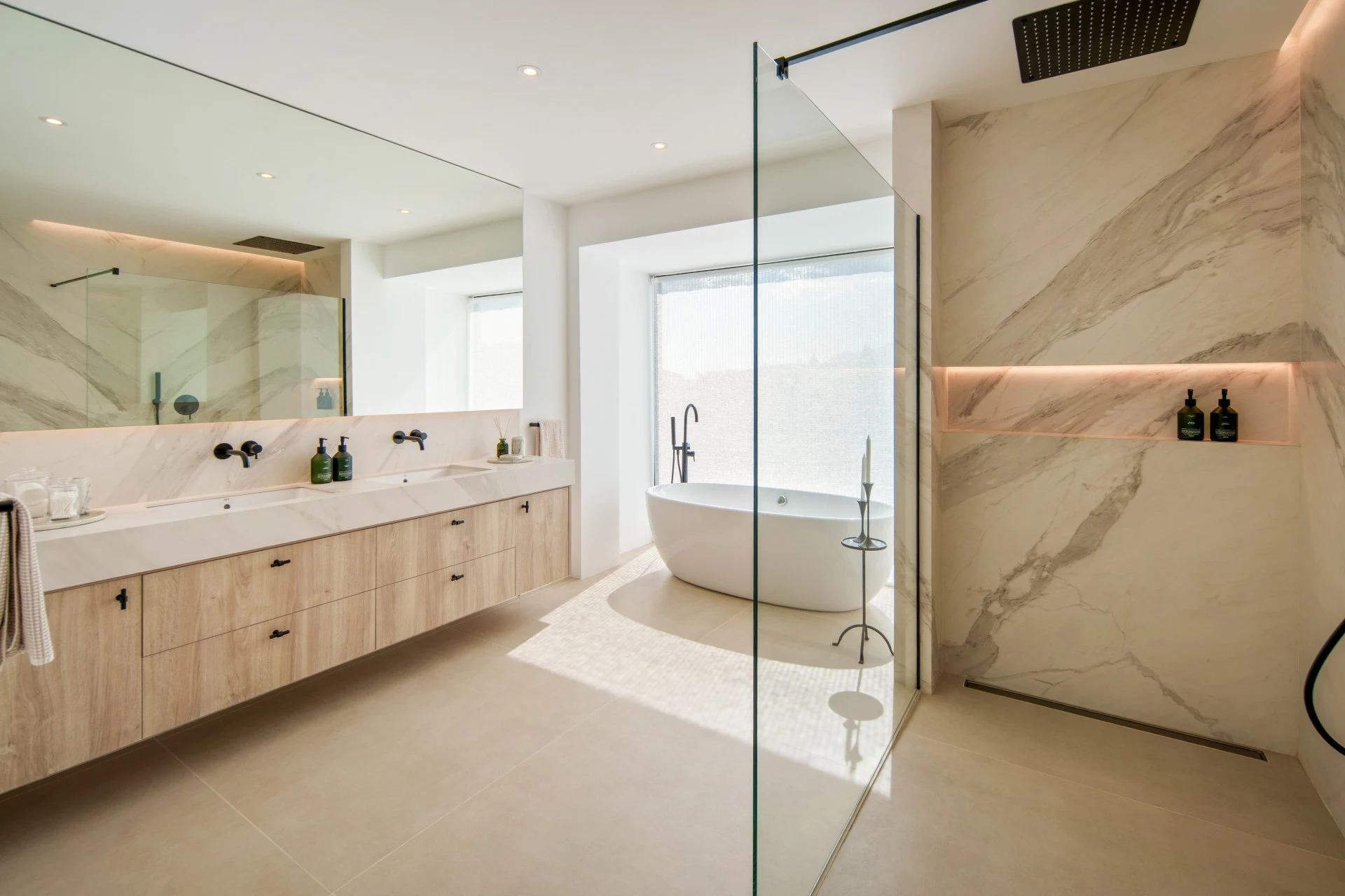 Bathroom with freestanding bath and glazed shower