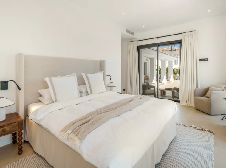 Guest bedroom opening to the covered pool terrace