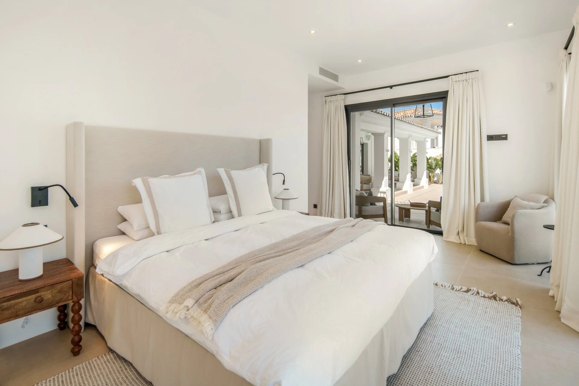 Guest bedroom opening to the covered pool terrace
