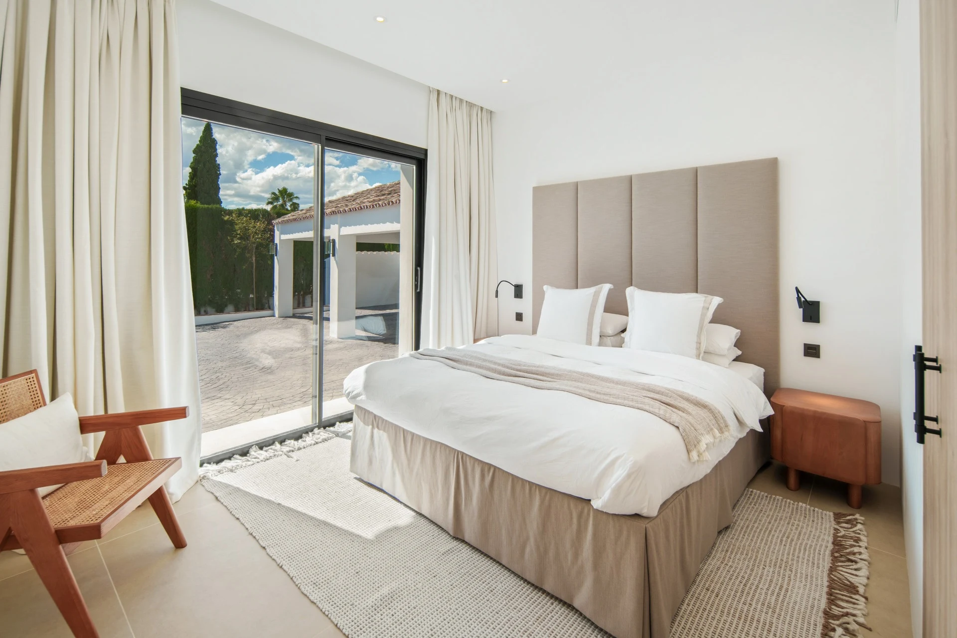Guest bedroom opening towards a private outdoor area