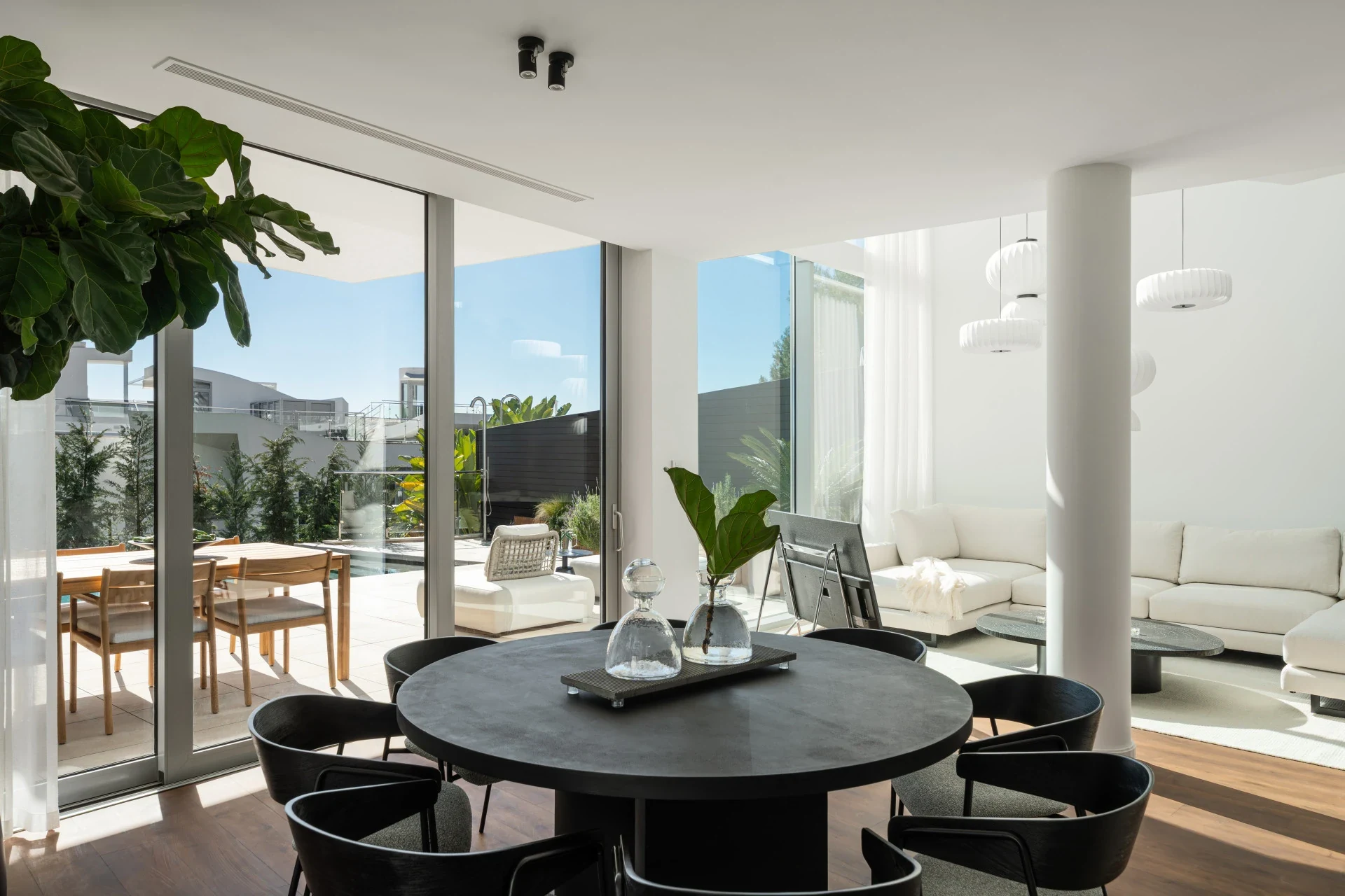 Open-plan dining area with pool terrace views