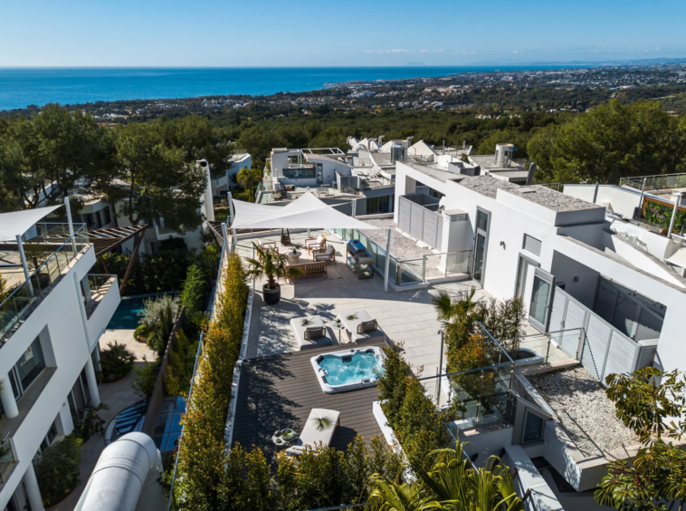 Elevated view across the rooftop terrace towards the coast