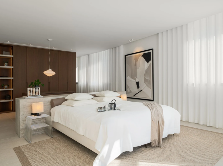 Bedroom with fitted storage and soft neutral finishes