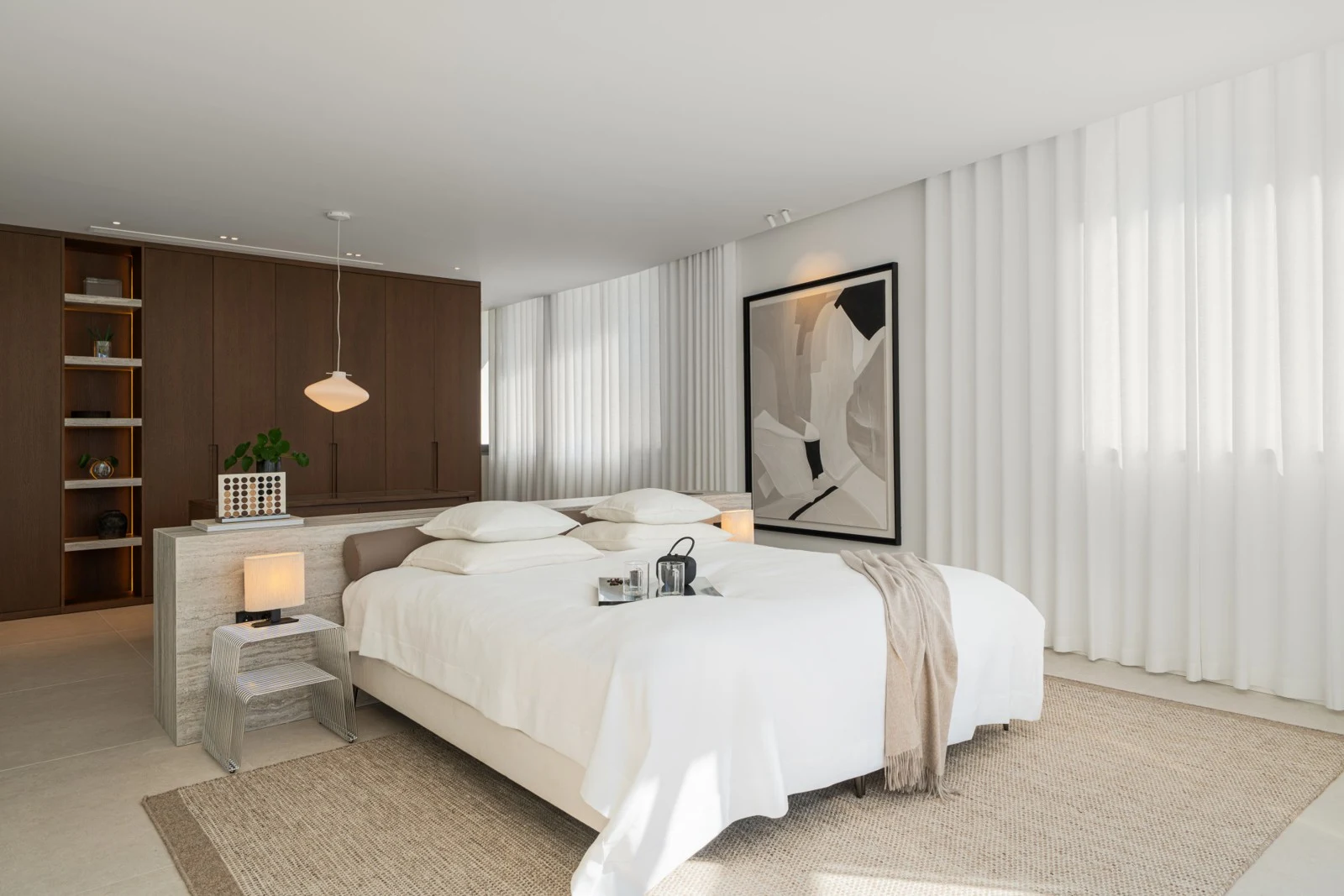 Bedroom with fitted storage and soft neutral finishes