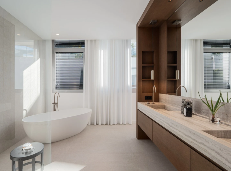 Bathroom with freestanding bathtub and double vanity