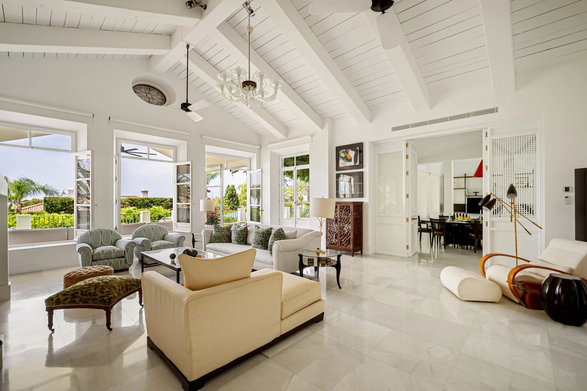 Bright vaulted living room opening to the garden