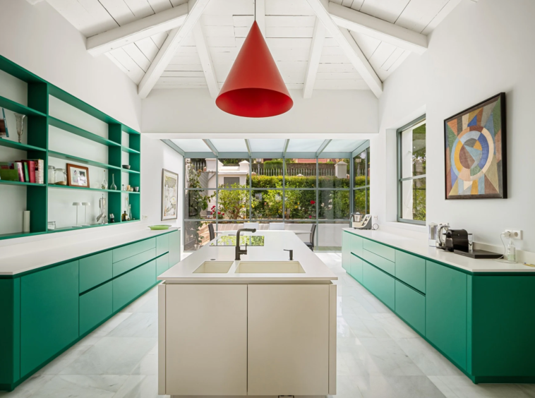 Contemporary green kitchen with a central island