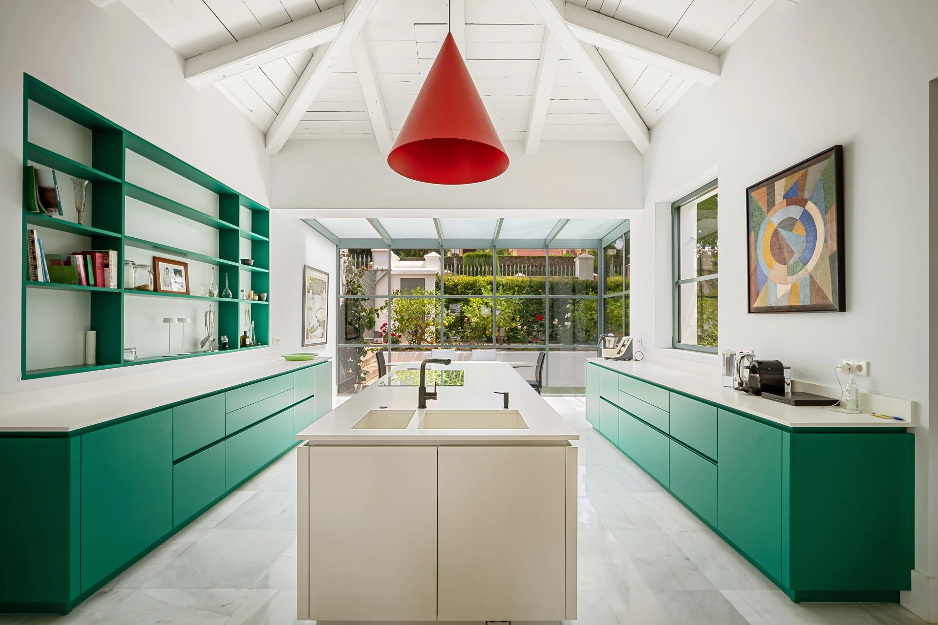 Contemporary green kitchen with a central island