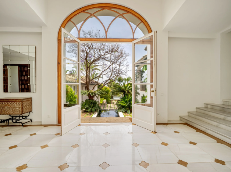 Arched entrance hall with garden views