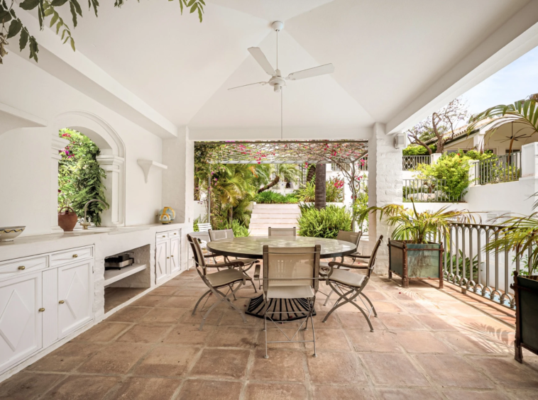 Covered dining terrace beside the garden