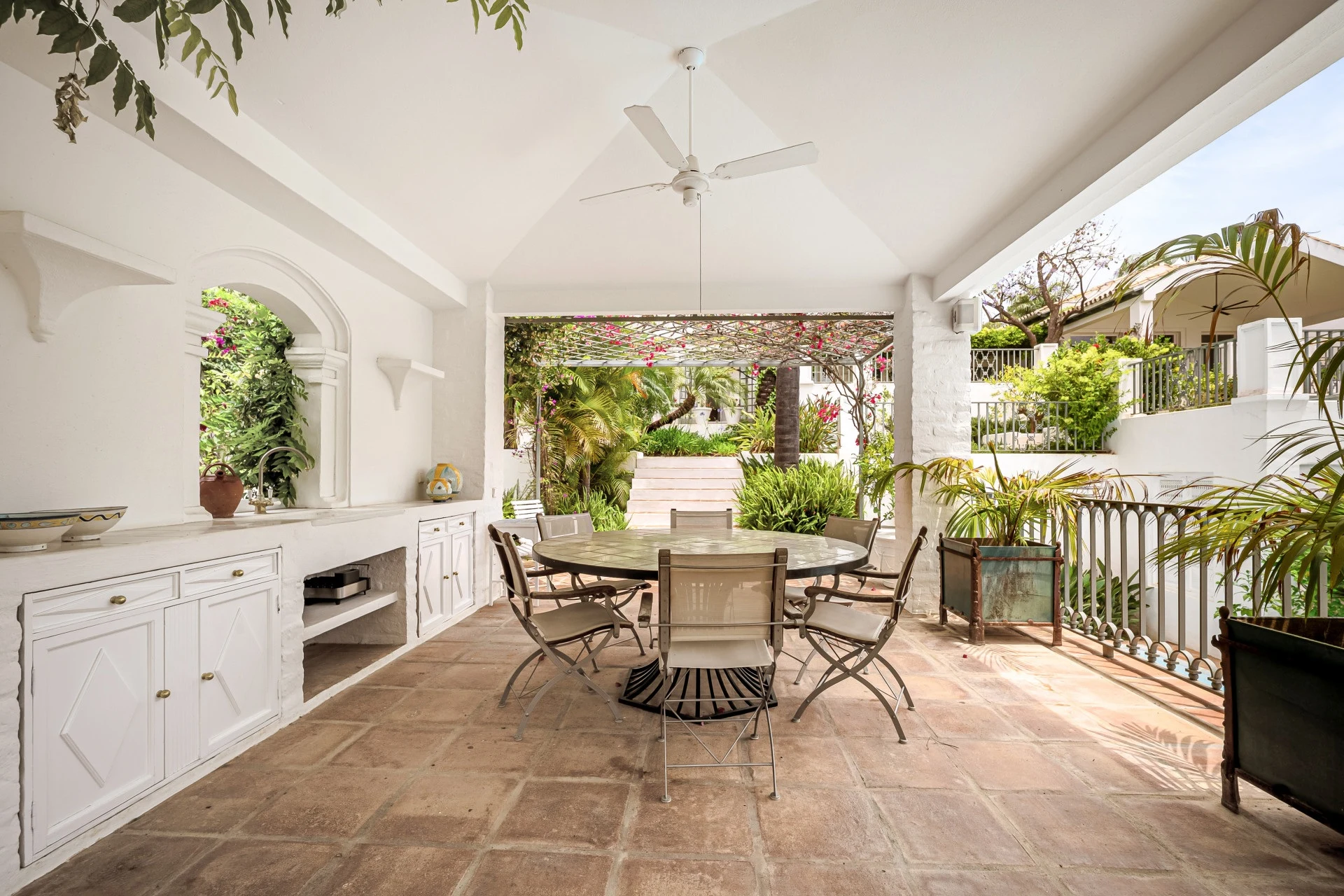 Covered dining terrace beside the garden