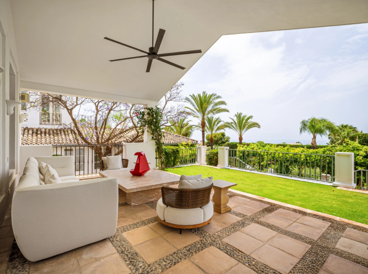 Shaded outdoor lounge with open views