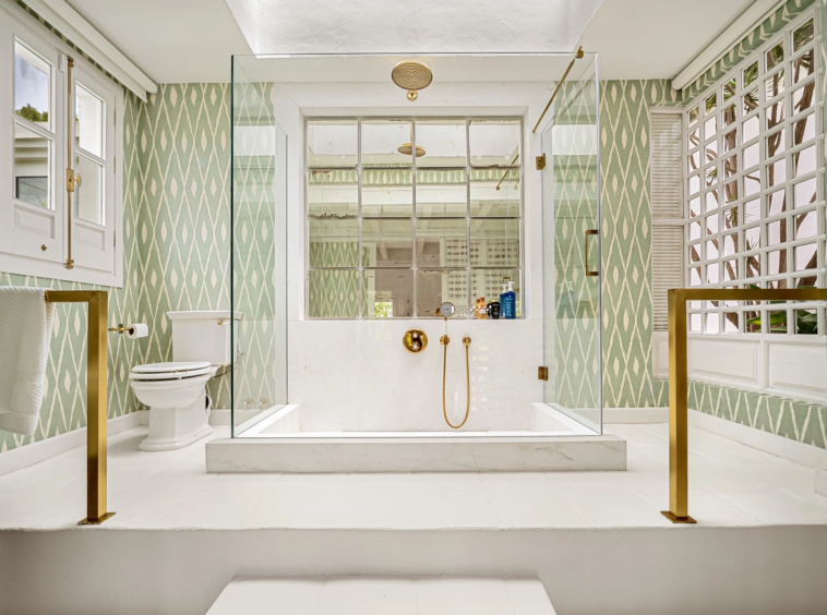 Bathroom with a freestanding bathtub and patterned tiles