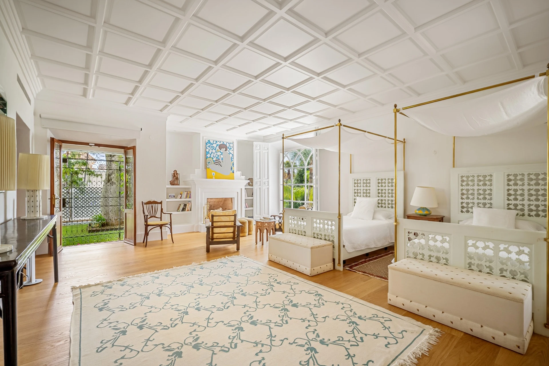 Spacious bedroom with vaulted ceiling and seating