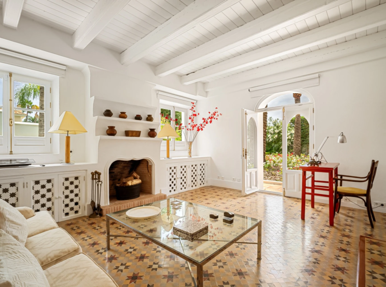 Guest lounge with fireplace and garden access