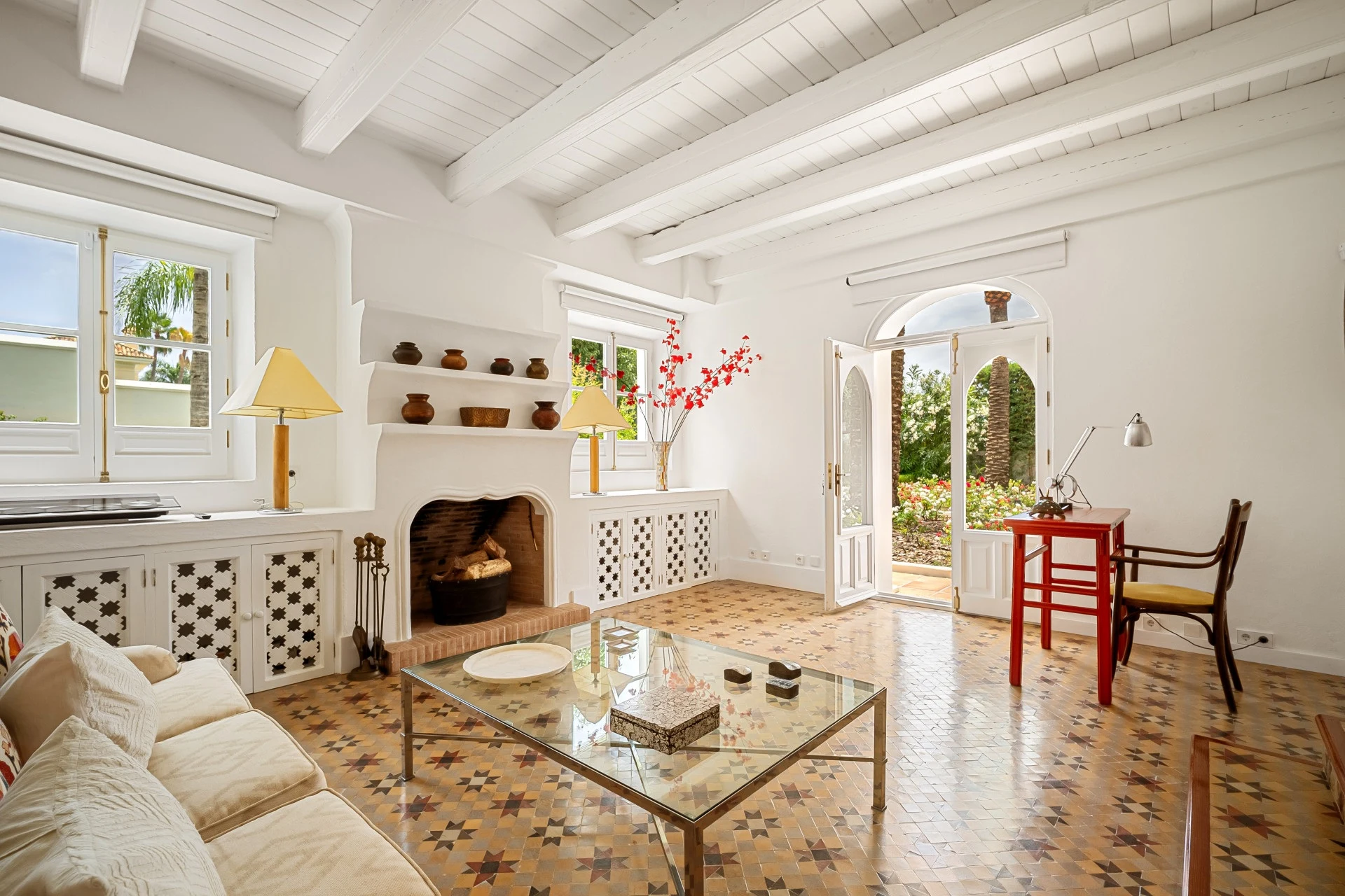 Guest lounge with fireplace and garden access