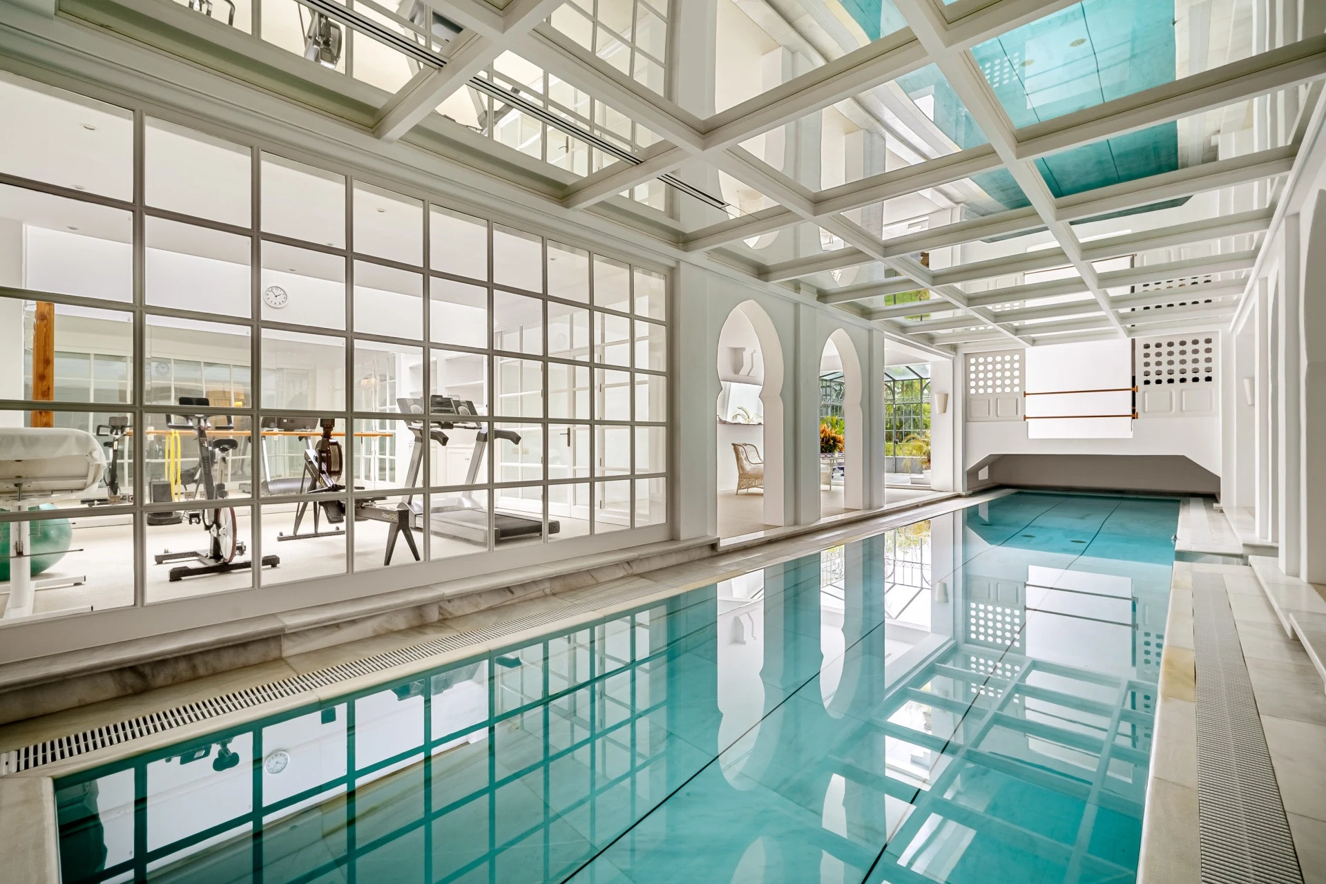 Indoor swimming pool beneath a glazed roof