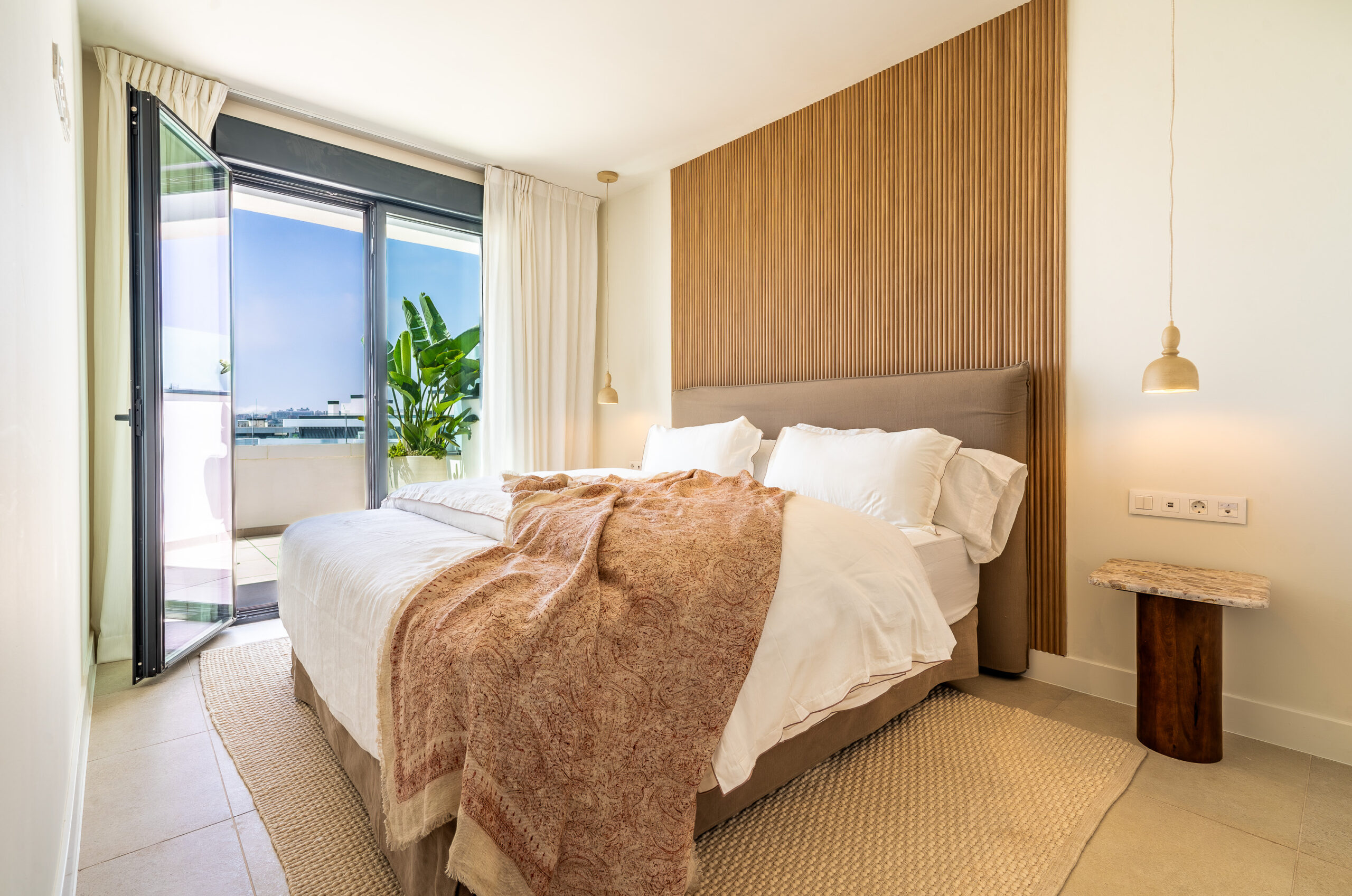 Representative main bedroom opening onto a terrace