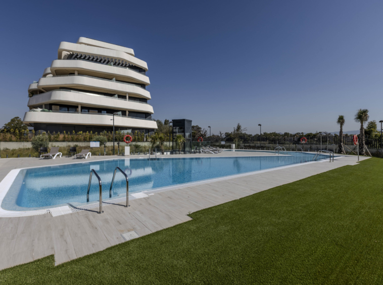 Communal pool and completed residential building in Torremolinos