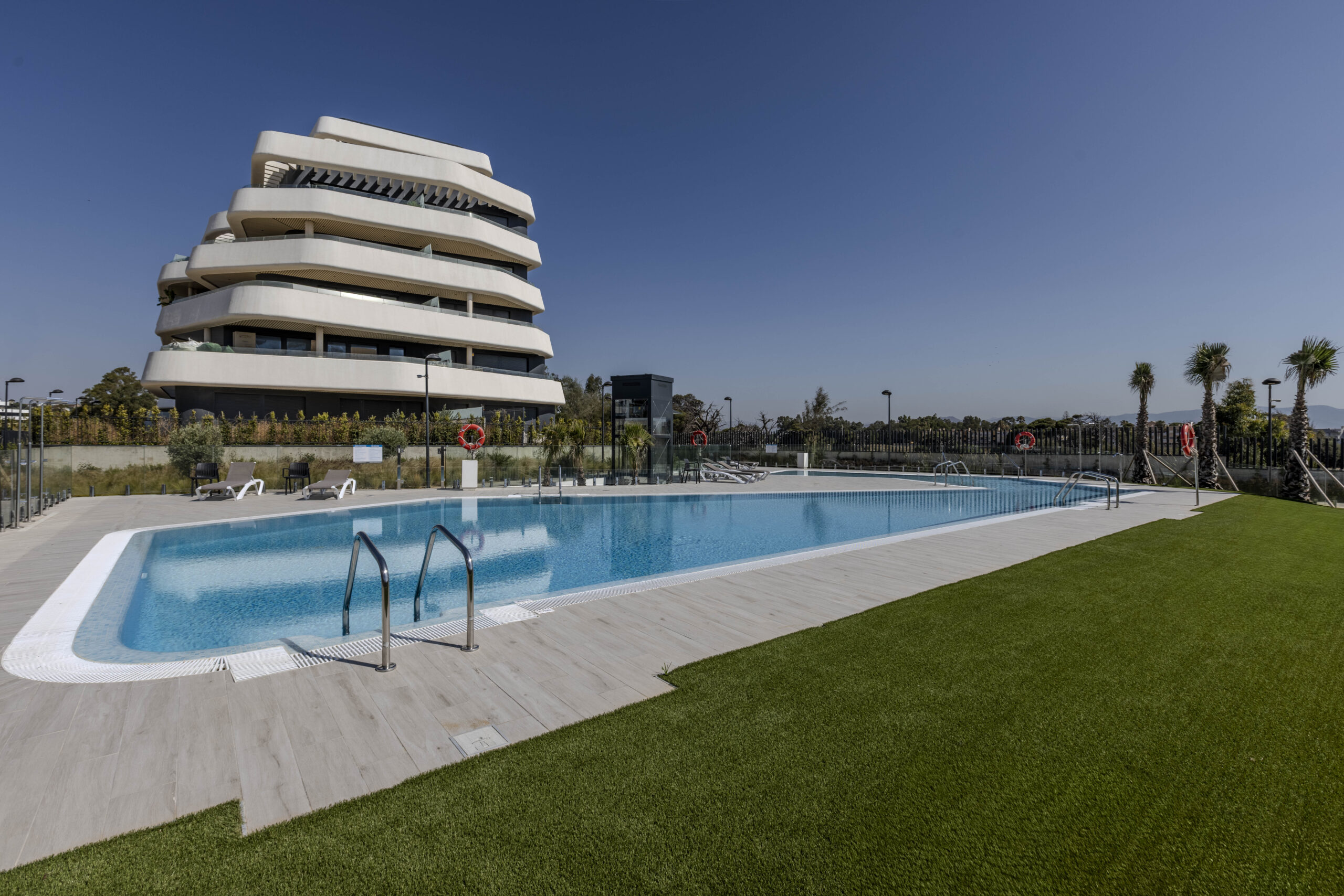 Communal pool and completed residential building in Torremolinos